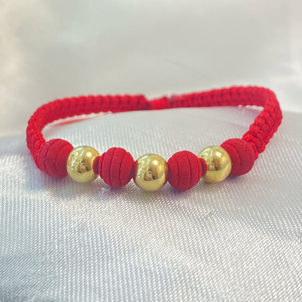PULSERA ROJA TEJIDA CON CENTRO DE NEOPRENO Y BALINES