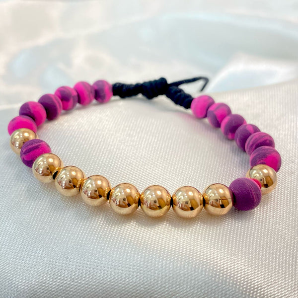 PULSERA NEGRA MEZCLADA ROSADA DE 9 BALINES ROSADOS