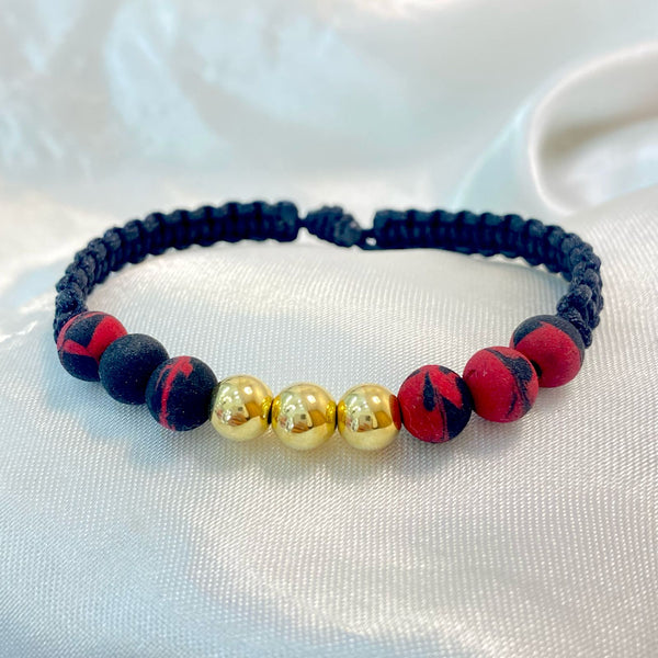 PULSERA NEGRA TEJIDA CON NEOPRENO MEZCLADO Y TRES BALINES