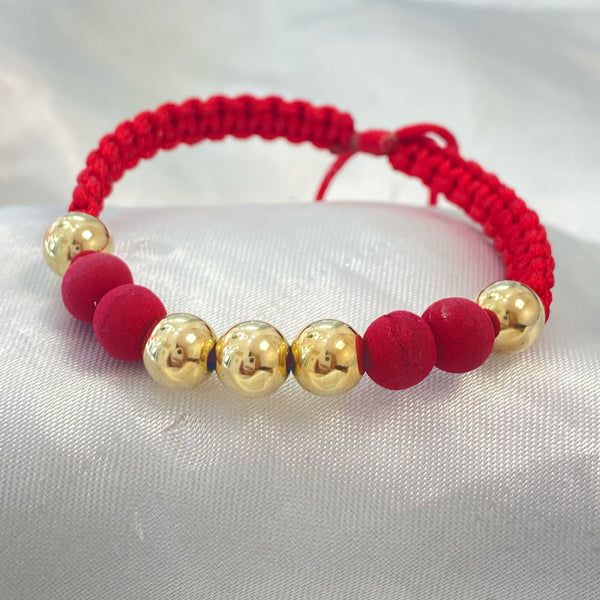 PULSERA ROJA TEJIDA CON CENTRO DE NEOPRENO Y BALIN