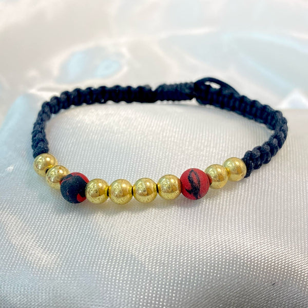 PULSERA NEGRA TEJIDA CON CENTRO DE BALIN Y NEOPRENO