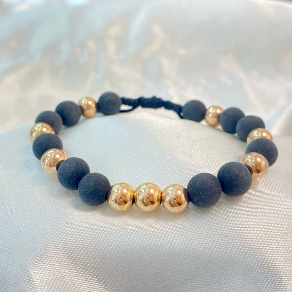PULSERA NEGRA INTERCALADA CON NEOPRENO Y BALIN ROSADO