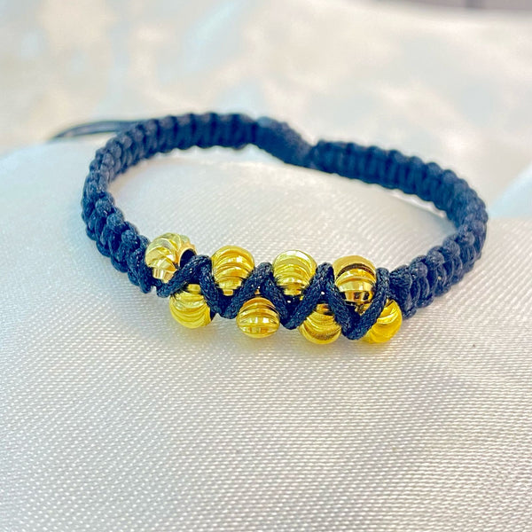 PULSERA NEGRA TEJIDA CON CENTRO ZIG ZAG DE BALIN DIAMANTADO
